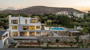 an aerial view of a house with a pool at Eunoia Blue Villa Heraklion Crete, Sea View, Private Pool, Prassas, Karteros in Prasás