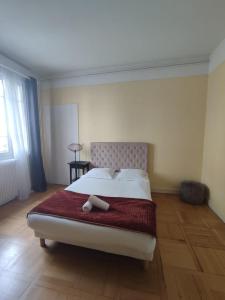 Posteľ alebo postele v izbe v ubytovaní La cour d'école à Tours + 6 fotografií