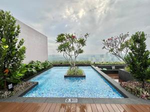 a swimming pool in the middle of a building at Riveria City KL Sentral by Guestsupply in Kuala Lumpur