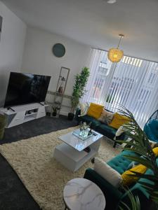 TV a/nebo společenská místnost v ubytování Glams luxury flat