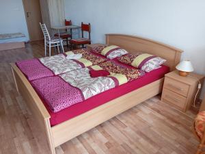 A bed or beds in a room at Apartmany Fantagiro