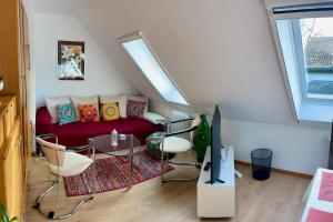 a living room with a couch and a table at Chez Lana in Berlin
