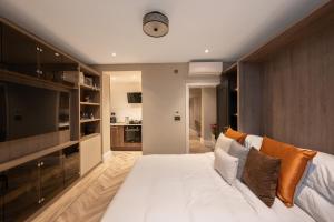 a bedroom with a large white bed in a room at Charles of Mayfair in London