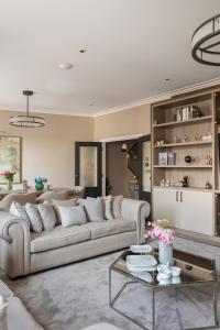 a living room with a couch and a table at Charles of Mayfair in London