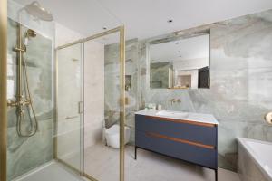 a bathroom with a shower and a sink and a toilet at Charles of Mayfair in London