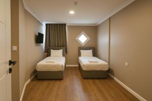 Ένα ή περισσότερα κρεβάτια σε δωμάτιο στο ERSA Hotel +31 φωτογραφίες