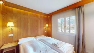 Postel nebo postele na pokoji v ubytování Abitaziun Suot Larsch 4 1 - Celerina