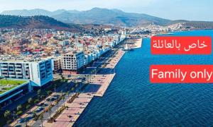 an aerial view of a city with the words family only at appartement 1 meublé et équipé in Nador