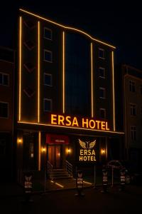 a hotel with a sign that reads esa hotel at night at ERSA Hotel in Tuzla