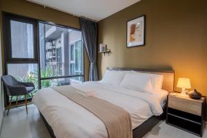 En eller flere senge i et værelse på 5 Star Sukhumvit Condo Infinity Pool Gym Sauna + 43 billeder