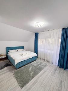 Postel nebo postele na pokoji v ubytování Valea Dorului Guest House