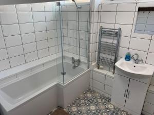 a bathroom with a shower and a sink at St James Dairy in Ilfracombe +23 photos