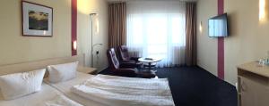 Postel nebo postele na pokoji v ubytování Panorama Hotel Bansin