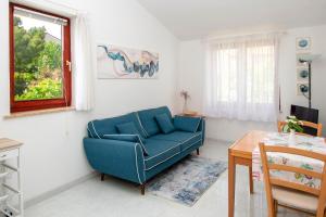 Ein Sitzbereich in der Unterkunft Apartment Iva