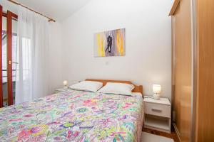 Ein Bett oder Betten in einem Zimmer der Unterkunft Apartment Iva