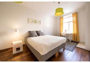 Ένα ή περισσότερα κρεβάτια σε δωμάτιο στο Heaven Apartment