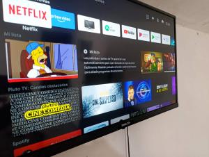 a television screen with a website on it at El ROBLE 2 in Córdoba
