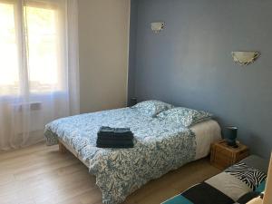 Postel nebo postele na pokoji v ubytování Chez Val et Phil