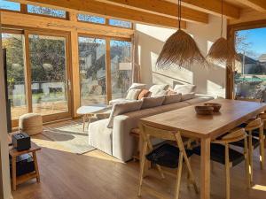 a living room with a couch and a table at Pleta Moragas in Osséja
