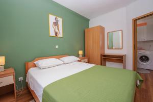 Ein Bett oder Betten in einem Zimmer der Unterkunft Apartment Iva