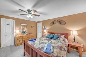a bedroom with a bed and a ceiling fan at Otter Slide 78I - A Cozy Mountain Retreat in North Creek