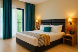 Кровать или кровати в номере Eleven Inn Tbilisi