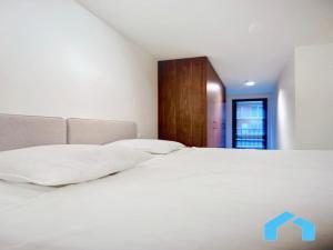 Ένα ή περισσότερα κρεβάτια σε δωμάτιο στο Apartment in Belgium near the Seaside