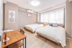 Postel nebo postele na pokoji v ubytování jinbocho str walk 6 min ,4 floors building 4dk for 13 person, 新宿駅12分 秋葉原5分 東京駅7分 銀座駅7分 渋谷20分