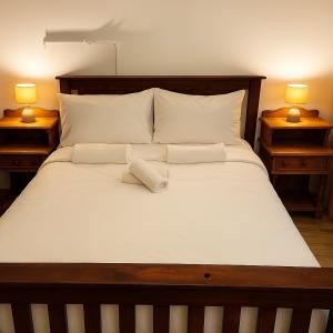 Ένα ή περισσότερα κρεβάτια σε δωμάτιο στο Ikhaya Lakho - 1