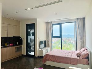 a bedroom with a bed and a large window at Thỏ homestay in Bắc Giang