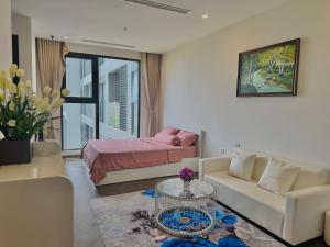 a living room with a couch and a bed at Thỏ homestay in Bắc Giang