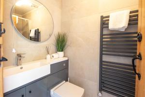 a bathroom with a sink and a mirror at Spring Lake 43, Jesse-Belle P in South Cerney +14 photos