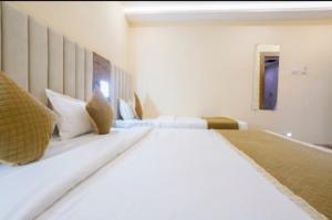 Postel nebo postele na pokoji v ubytování Hotel Crystal Place