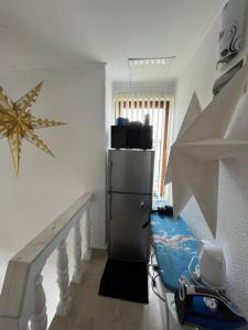 a room with a staircase with a star on the wall at Bayrakova Guest House in Dobrinishte