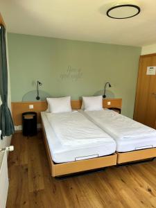 Voodi või voodid majutusasutuse Hotel WALZ toas