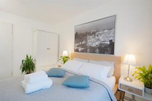 a bedroom with a bed with two pillows on it at Entire 4-Bed House & Parking, Steps from ICC & Utilita Arena Birmingham & Broad Street in Birmingham