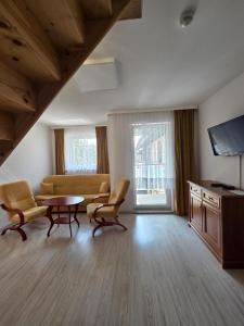 Μια τηλεόραση ή/και κέντρο ψυχαγωγίας στο Apartamenty Zachodnia Przystań