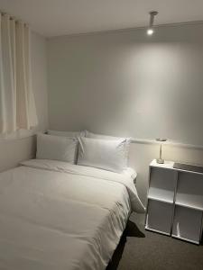 Ліжко або ліжка в номері 누크인 nook Inn