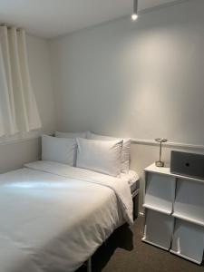 Ліжко або ліжка в номері 누크인 nook Inn