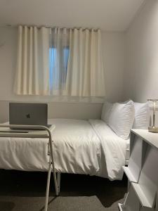 Ліжко або ліжка в номері 누크인 nook Inn