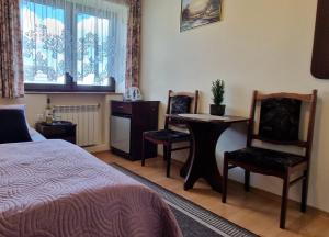 Posteľ alebo postele v izbe v ubytovaní Pokoje Apartamenty Pod Limbą