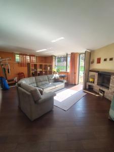 a living room with a couch and a fireplace at Appartamento Sleep&Fly in Grassobbio +19 photos