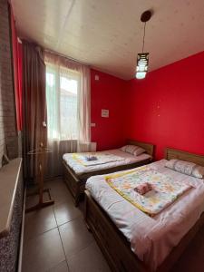 Postel nebo postele na pokoji v ubytování Guest House Barbi