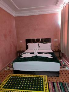 A bed or beds in a room at Riad Rime Garden Marrakech