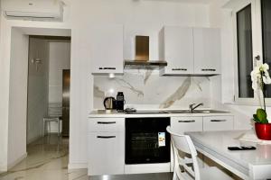 Kuchyň nebo kuchyňský kout v ubytování Residence JASMIN 2P