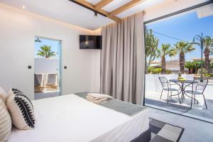 Posteľ alebo postele v izbe v ubytovaní Cactus Suites