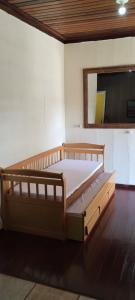 a bedroom with a large bed in a room at Sitio Oliveira Ibiuna in Ibiúna +25 photos