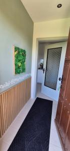 a hallway with a door and a painting on the wall at Green Home in Furth im Wald