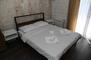 Postel nebo postele na pokoji v ubytování Apartmani Drijen