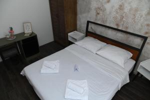 Postel nebo postele na pokoji v ubytování Apartmani Drijen